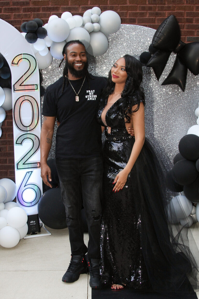 Prom couple portrait with balloon backdrop by Dope Pixx