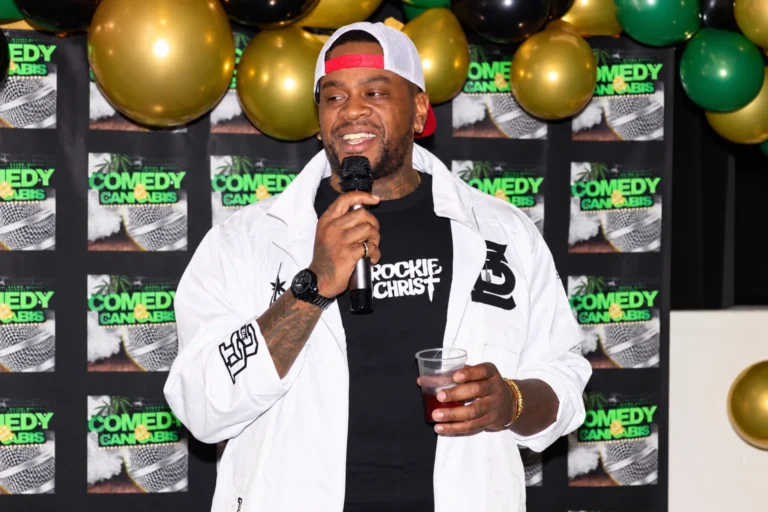 Comedian on stage at a live comedy event, photographed by Dope Pixx